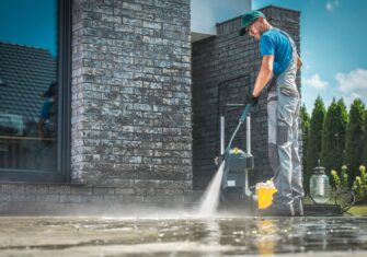 Pressure washing a brick building. How to Plan Your Next Pressure Washing Project at Your Busy Facility