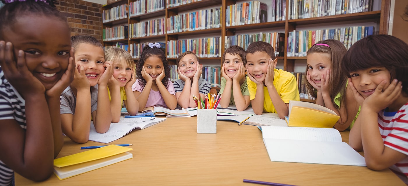 a diverse group of school children at their desk